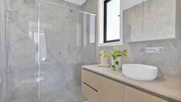 Shower, hair dryer, towels, soap