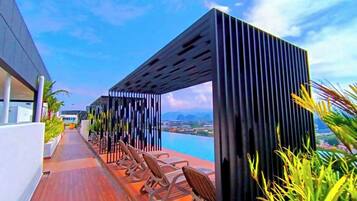 Indoor pool, open 7:00 AM to 11:00 PM, pool loungers