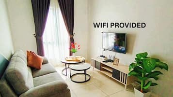 Business Apartment | Living area | 177-cm Smart TV with digital channels