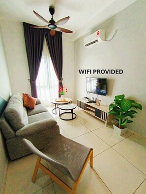 Business Apartment | Living area | 177-cm Smart TV with digital channels