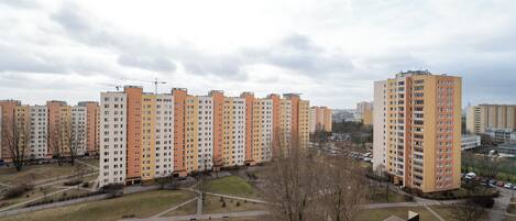 A residential area with apartment buildings, a playground, and a park.