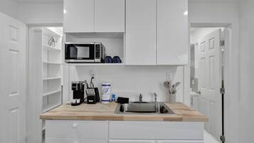 Fridge, microwave, stovetop, coffee/tea maker