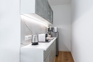 Fridge, microwave, stovetop, coffee/tea maker