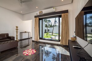 Suite, 1 King Bed, Smoking, Pool View | Living area - The Saravi Resort (Vanur)