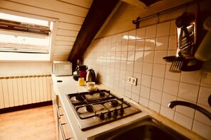 Fridge, microwave, stovetop, coffee/tea maker