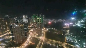 A nighttime cityscape with high-rise buildings and illuminated streets. - Fort Victoria (Taguig)