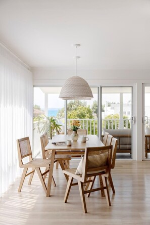 Enjoy meals in this spacious dining area with a large round table and six comfortable chairs.