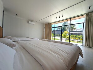 Habitación familiar | Sábanas de algodón egipcio y ropa de cama de alta calidad 