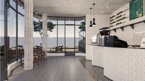 A modern cafe interior with a wooden ceiling, large windows, and a counter displaying a menu.