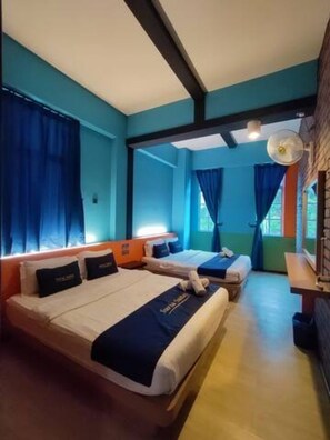 A hotel room with two beds, a desk, and a window with curtains. - Suria Suites at Tanah Rata (Tanah Rata)