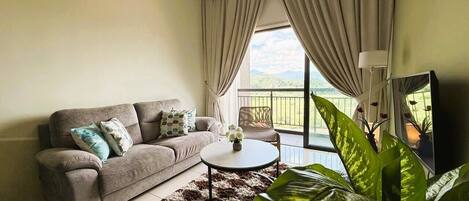 Executive Apartment | Living area | 800-cm Smart TV with digital channels