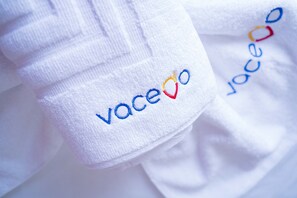 A close-up of a white towel with the embroidered text "vaceo". - Athens Colors Suite (Athens)