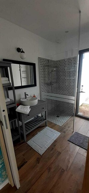 Shower, hair dryer, towels, toilet paper