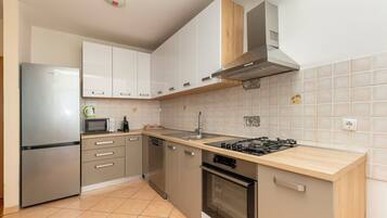 Apartment (A1) | Private kitchen | Oven, electric kettle, toaster