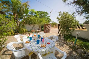 Standard House, Multiple Bedrooms (Villetta Fina Bella -Near Sandy Beach) | Outdoor dining - Villetta Fina Bella -near Sandy Beach (Porto Cesareo)