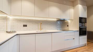 Apartment (1 Bedroom) | Private kitchen | Fridge, microwave, oven, dishwasher