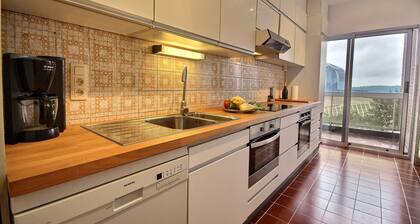 Magnificient view in a tree-filled setting | Adelo