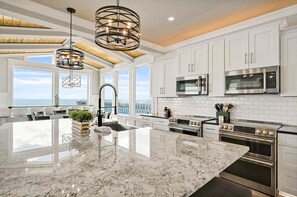 Fridge, microwave, oven, stovetop - Experience luxury at Suite Caroline, an oceanfront haven in Oak Island, NC! (Oak Island)