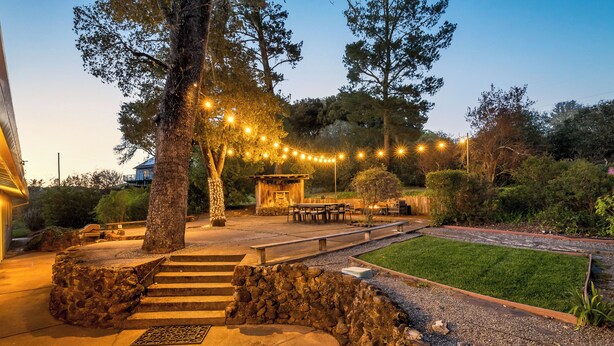 A patio area with outdoor seating, a stone staircase, and string lights. - Wine Country Retreat w/ Pool, 10 Mi to Dtwn Sonoma (Glen Ellen)