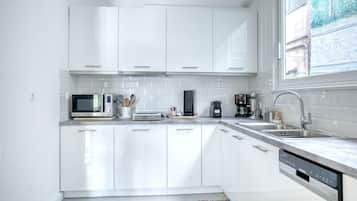 Three Bedroom Apartment | Private kitchen | Full-size fridge, microwave, stovetop, dishwasher