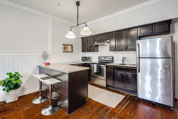 Fridge, microwave, stovetop, coffee/tea maker