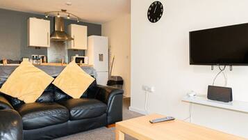 Apartamento conforto | Área de estar | TV LED 32 polegadas com canais digitais