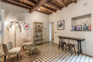 Deluxe Apartment, 2 Bedrooms | Living area | 50-inch Smart TV with digital channels - BRAMA by HiSuiteRome (Rome)