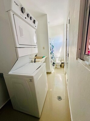 Shower, hair dryer, towels, soap