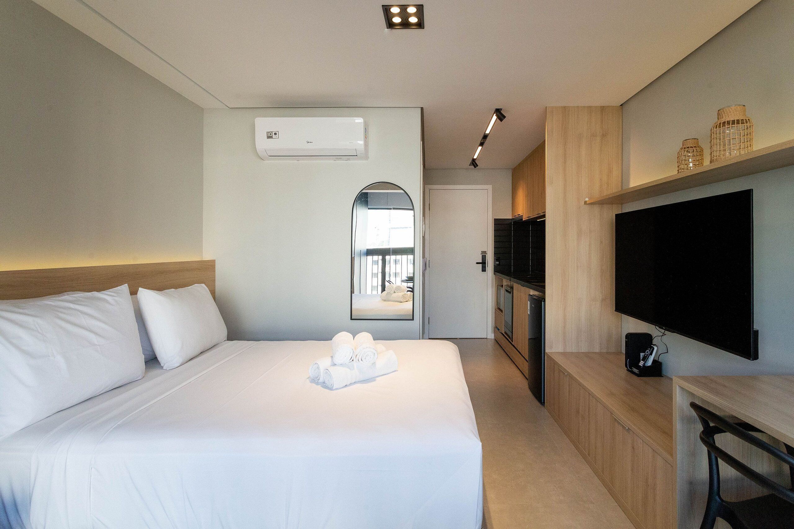 Premium bedding, desk, laptop workspace, blackout curtains