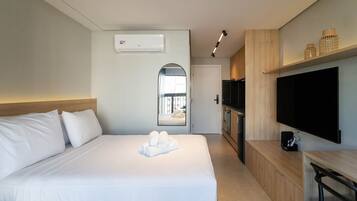 Premium bedding, desk, laptop workspace, blackout curtains