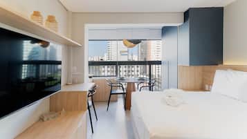 Studio 1015 NIK | Premium bedding, desk, laptop workspace, blackout drapes