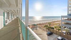 A balcony with a view of the beach and ocean. - Beachfront Studio, Sleeps 3, Pool (Panama City Beach)