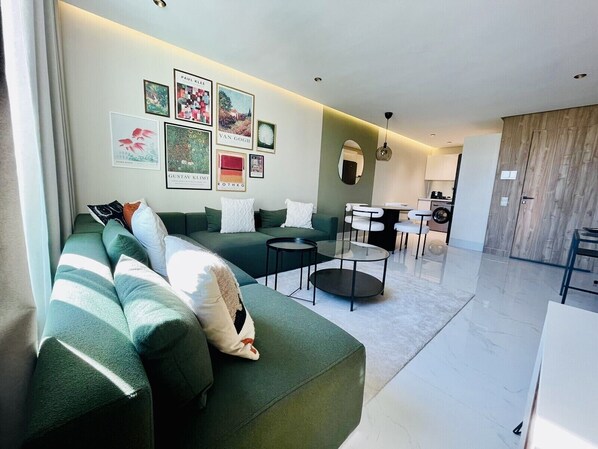 Exclusive Apartment | Living area | 50-inch Smart TV with satellite channels, Netflix, streaming services