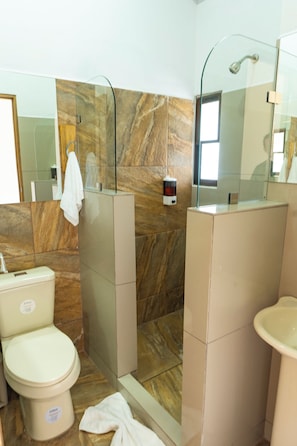 Shower, rainfall showerhead, hair dryer, towels