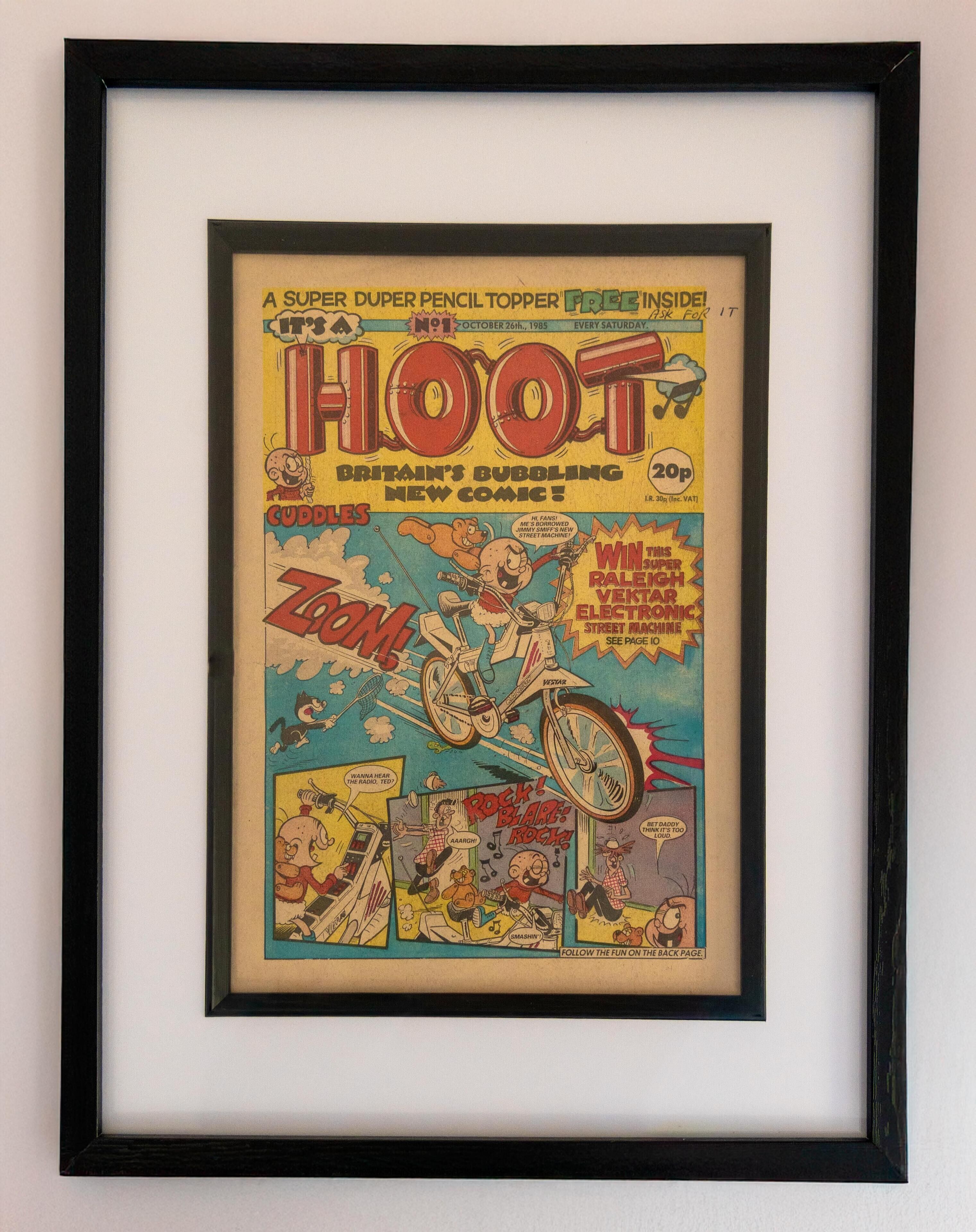 A framed comic book titled 'Hoot' with a 20p price tag.