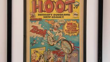 A framed comic book titled 'Hoot' with a 20p price tag.