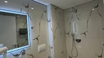 Hair dryer, towels, shampoo, toilet paper