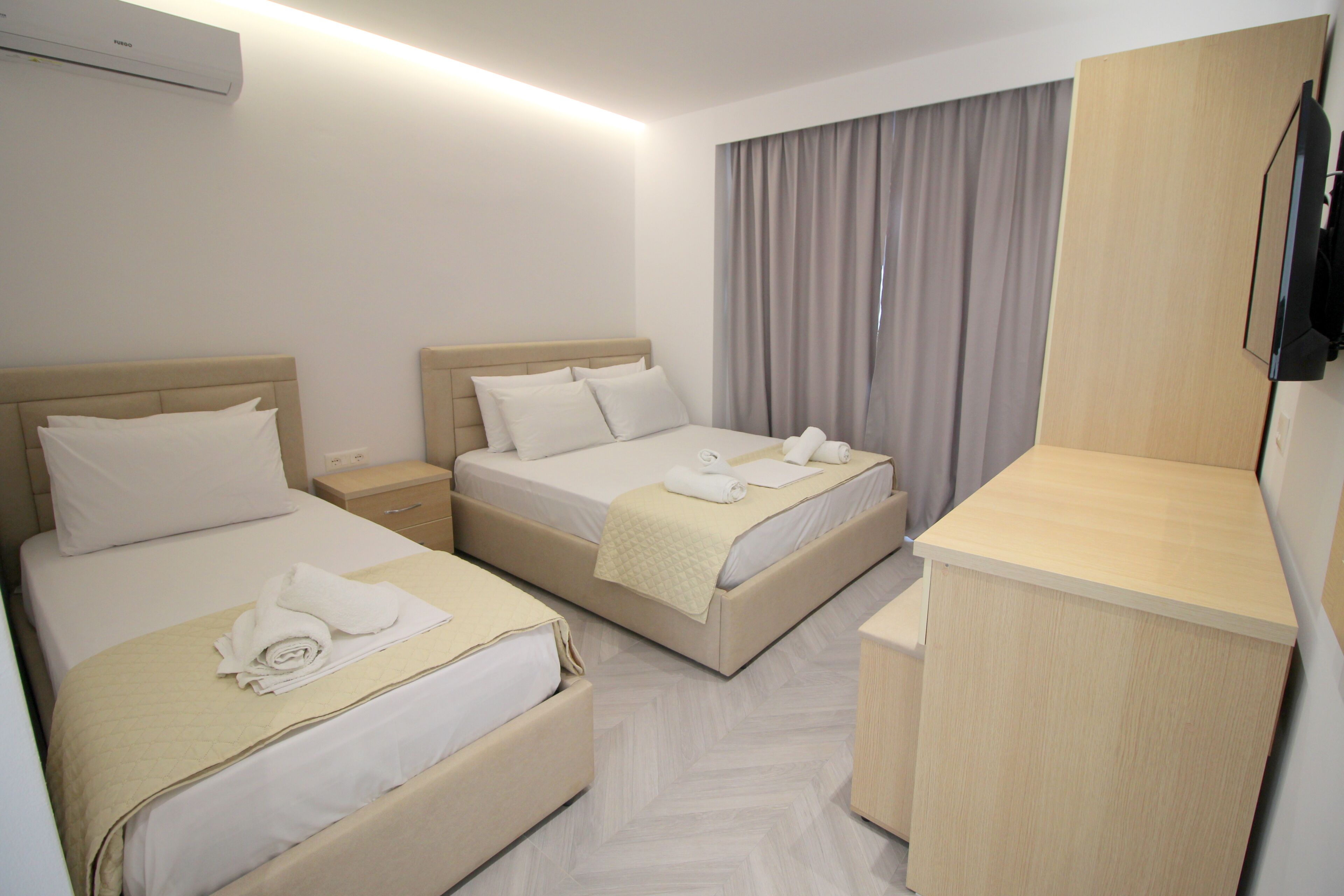 Deluxe Triple Room, Pool View | Desk, soundproofing, free WiFi