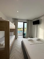 Quadruple Room, Pool View | Desk, soundproofing, free WiFi, bed sheets