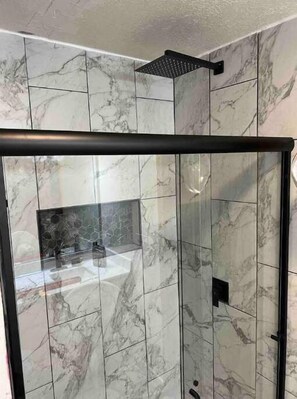 Shower, hair dryer, towels, toilet paper
