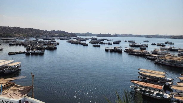A harbor filled with numerous boats docked at piers. - Dahab Guest House (Aswan)