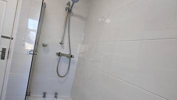 Combined shower/bathtub, deep-soaking bathtub, hair dryer, towels