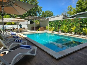 Outdoor pool, pool umbrellas, pool loungers