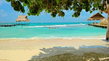 On the beach, sun-loungers, beach towels