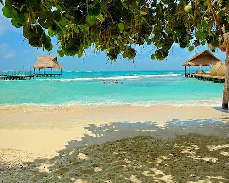 On the beach, sun loungers, beach towels