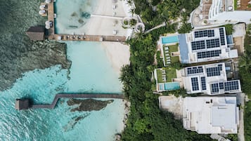 On the beach, sun-loungers, beach towels