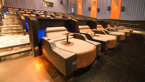A theater with tiered seating and a stage. - Furnished 4BR Pool Home Near Randolph AFB for PCS, TDY & Military Families in SA (Universal City)