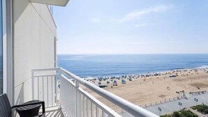 A balcony with a view of a beach. - Oceanfront Luxury at Hilton Oceanaire Resort – Two Stunning Oceanview Balconies! (Virginia Beach)