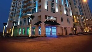 A high-rise hotel with multiple floors, balconies, and a prominent sign reading "OCEANVIEW". - Oceanfront Luxury at Hilton Oceanaire Resort – Two Stunning Oceanview Balconies! (Virginia Beach)