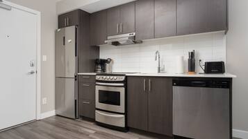 Apartment | Private kitchen | Full-size fridge, coffee/tea maker, freezer